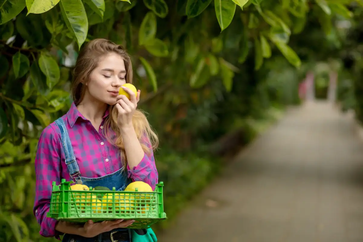 young woman smelling lemons