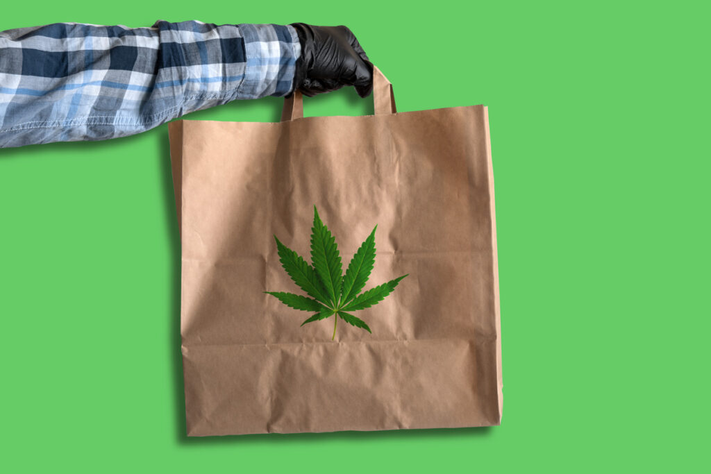 Courier Holding Marijuana Delivery Bag