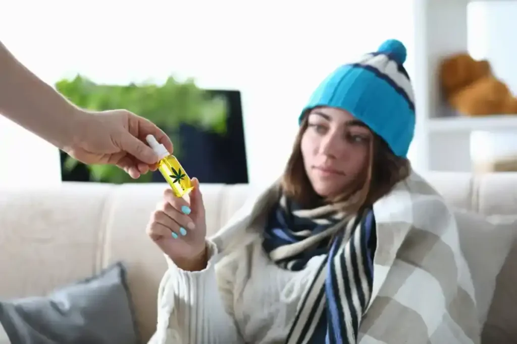 Girl with a sweater getting a CBD product