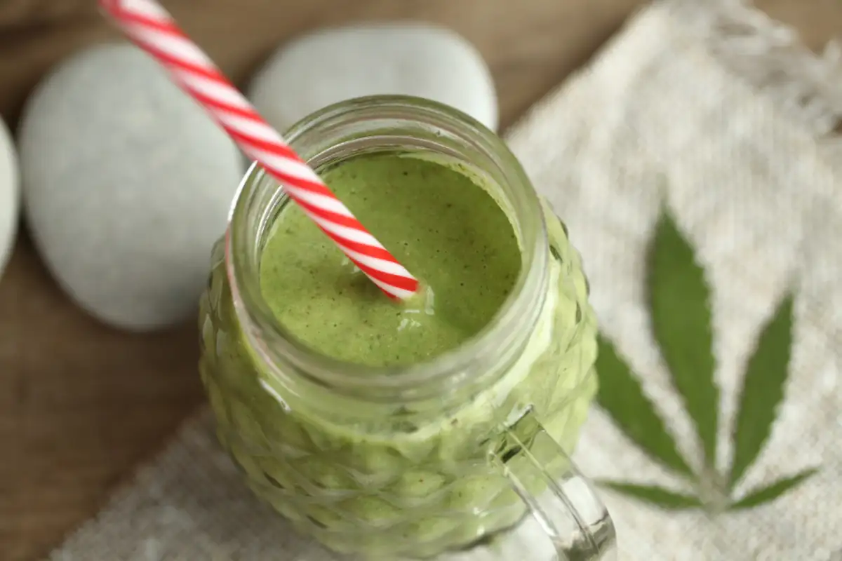 Smoothie with cannabis plant on side