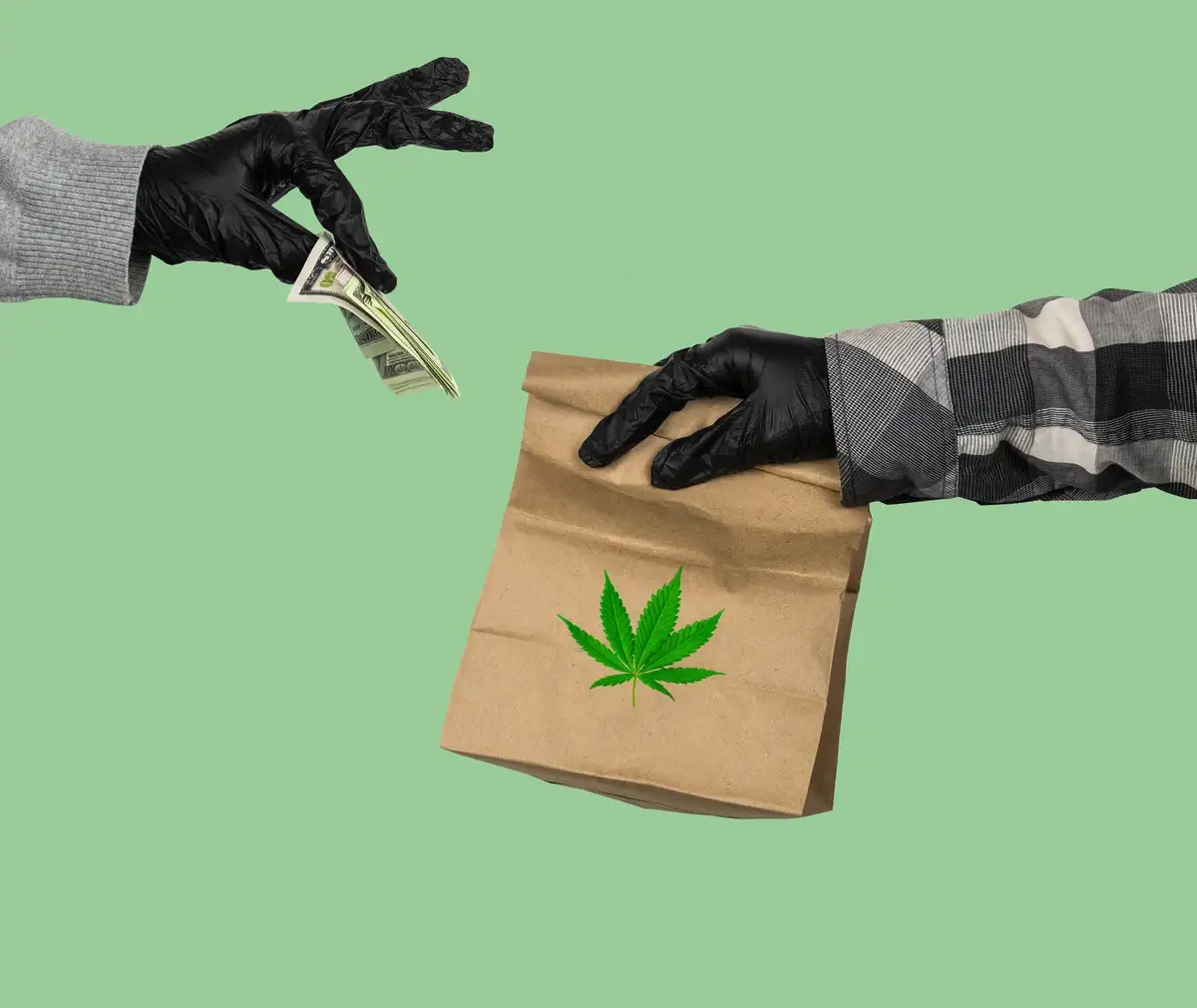 Man handling cannabis product and other man paying for it