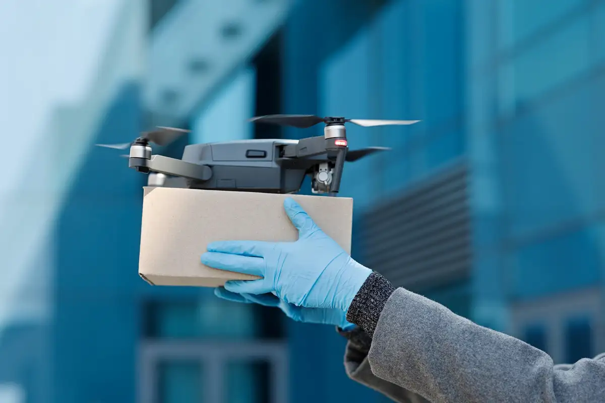 Man holding a package for drone delivery