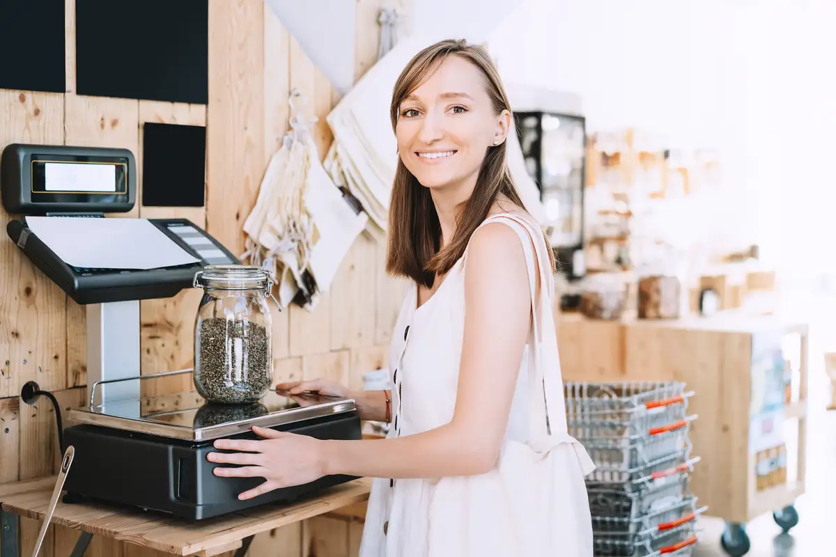 Woman standing in front of a cannabis seeds