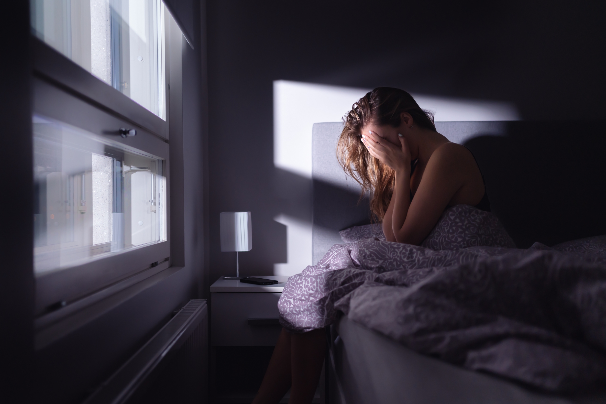 Sad Depressed Woman In Bed