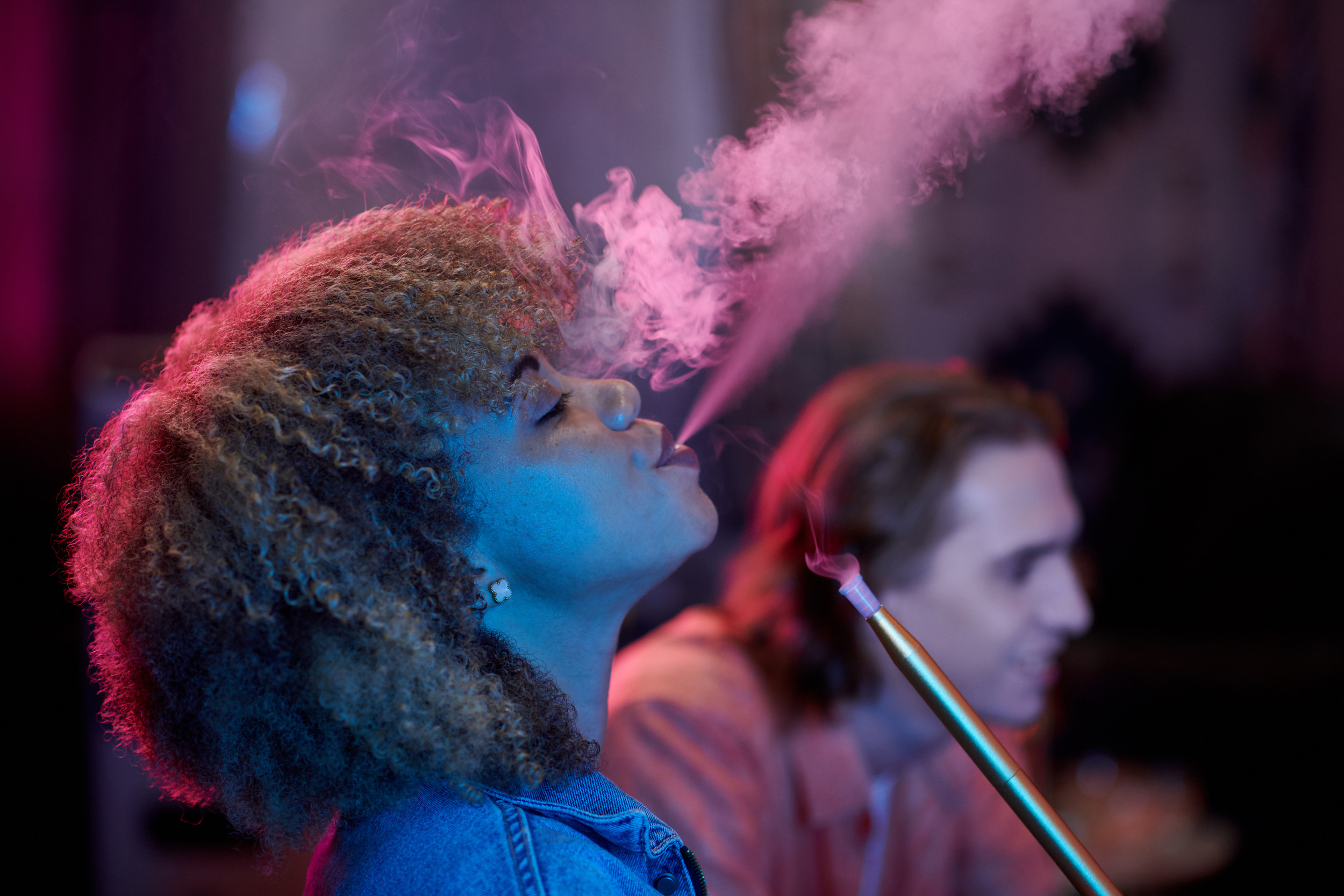 young-woman-exhaling-smoke