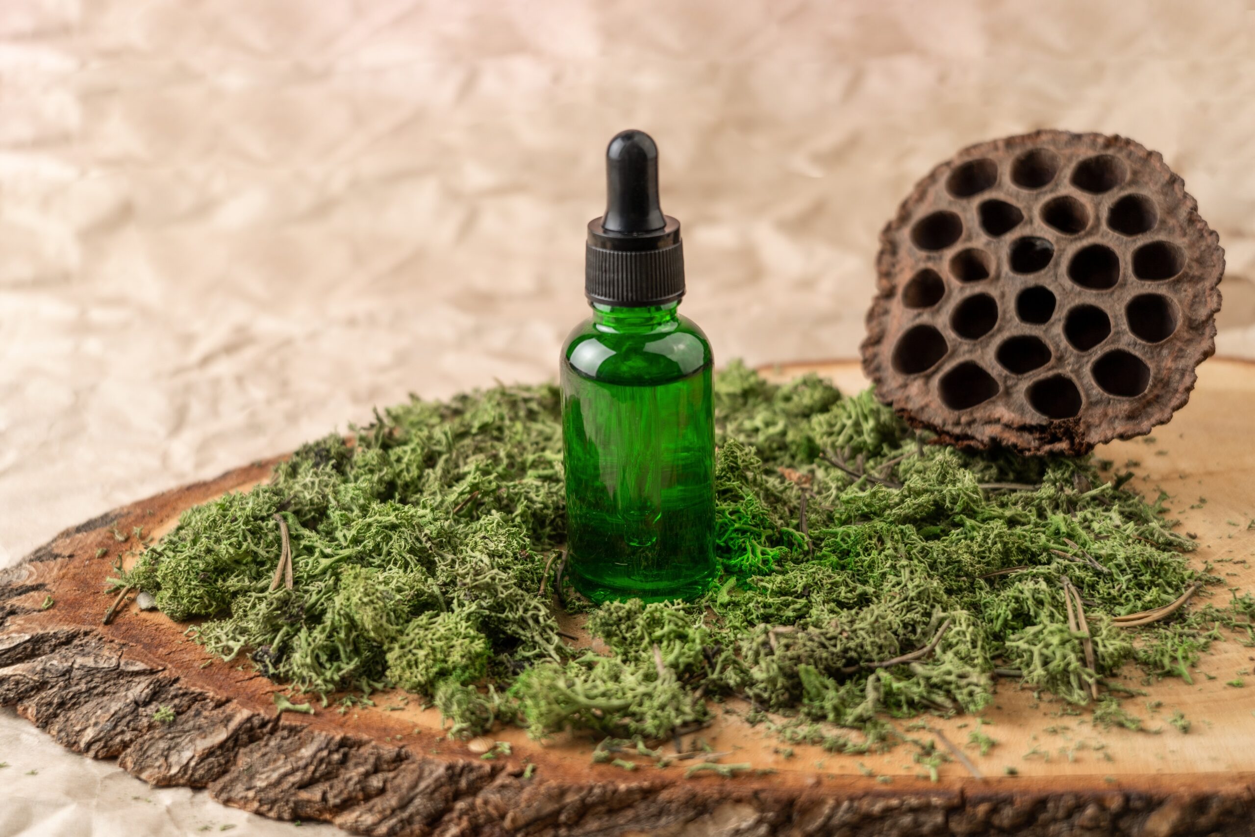a-green-dropper-bottle-of-face-serum-or-natural-oil