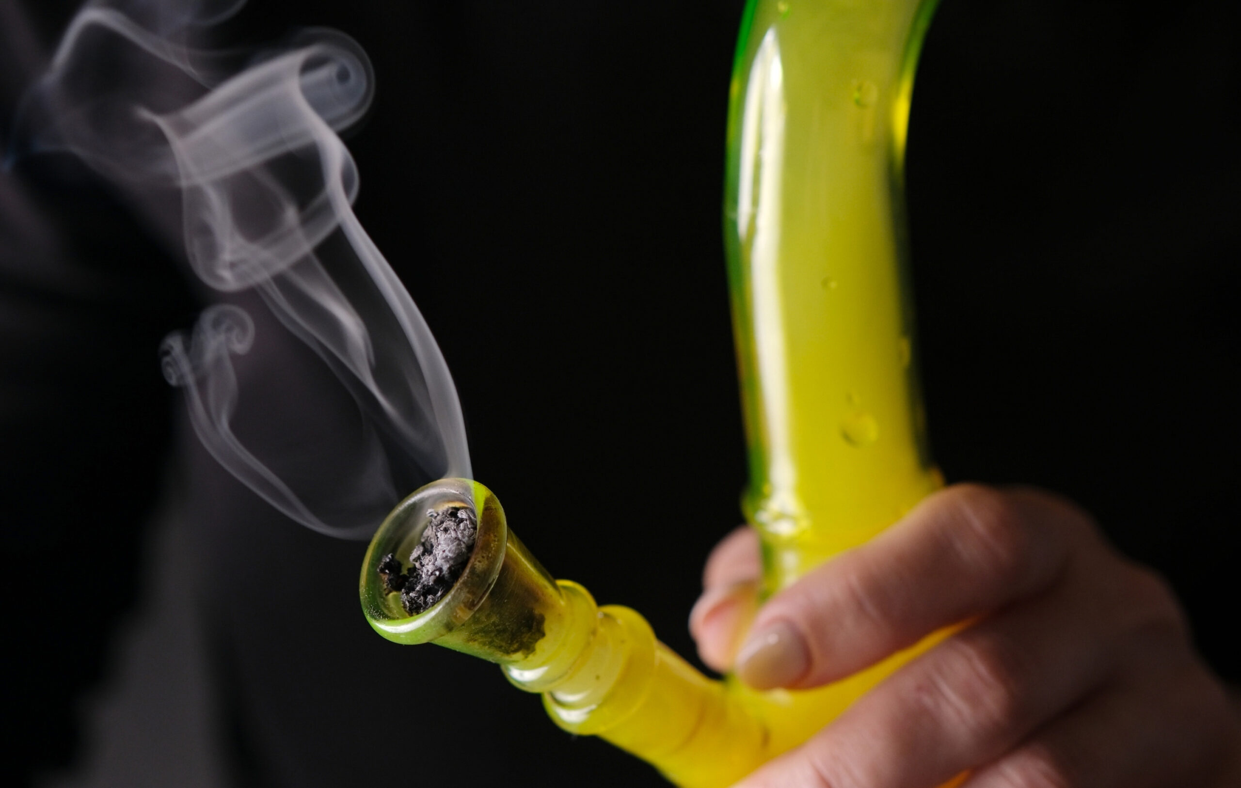 close-up-of-woman-smoking-cannabis-with-bong