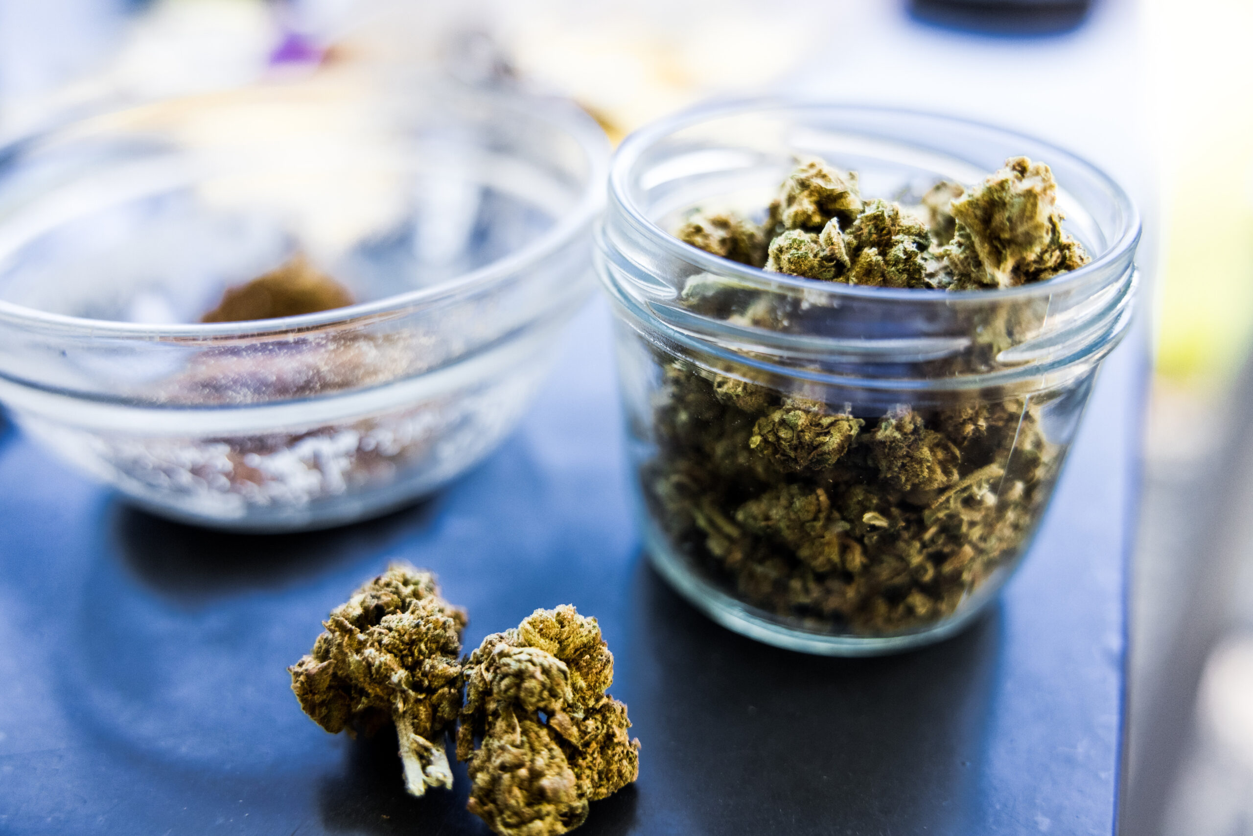 closeup-shot-of-weed-clumps-in-a-glass-bowl-and-jar