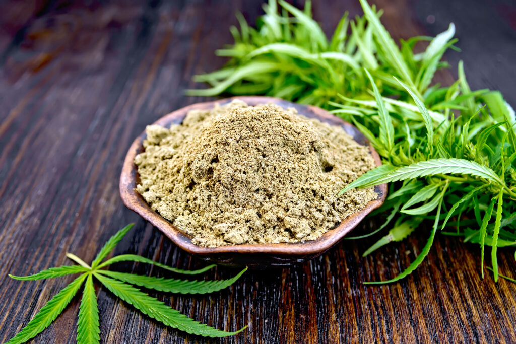 flour-hemp-in-clay-bowl-with-leaf-on-dark-board